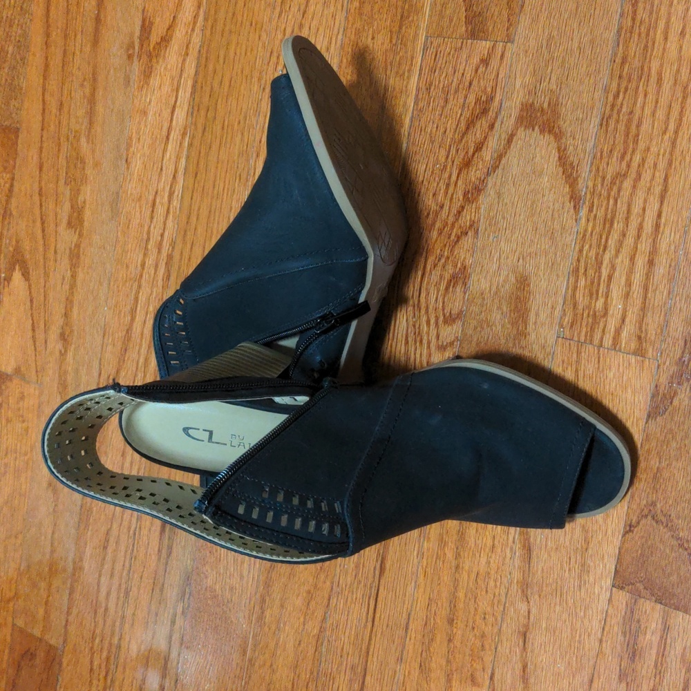 Black booties with a peekaboo toes. Side zipper. Black with brown heel.